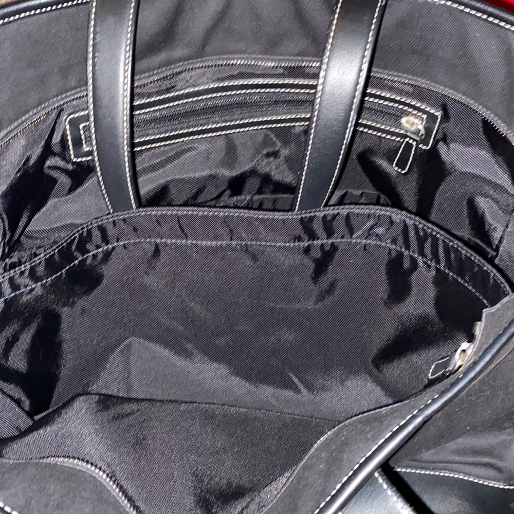 Very nice leather and nylon Coach travel bag with tons of room.